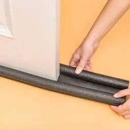 Installing black door bottom seal strip under a white door - DrutoBD