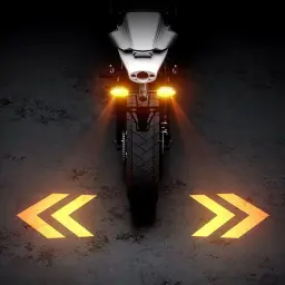 Rear view of a motorcycle projecting bright yellow double chevron arrows onto the ground