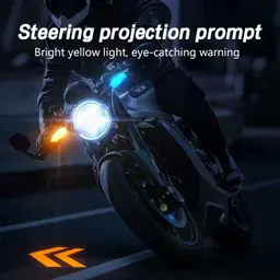 Front view of a bike displaying bright yellow steering projection prompt on the road at night
